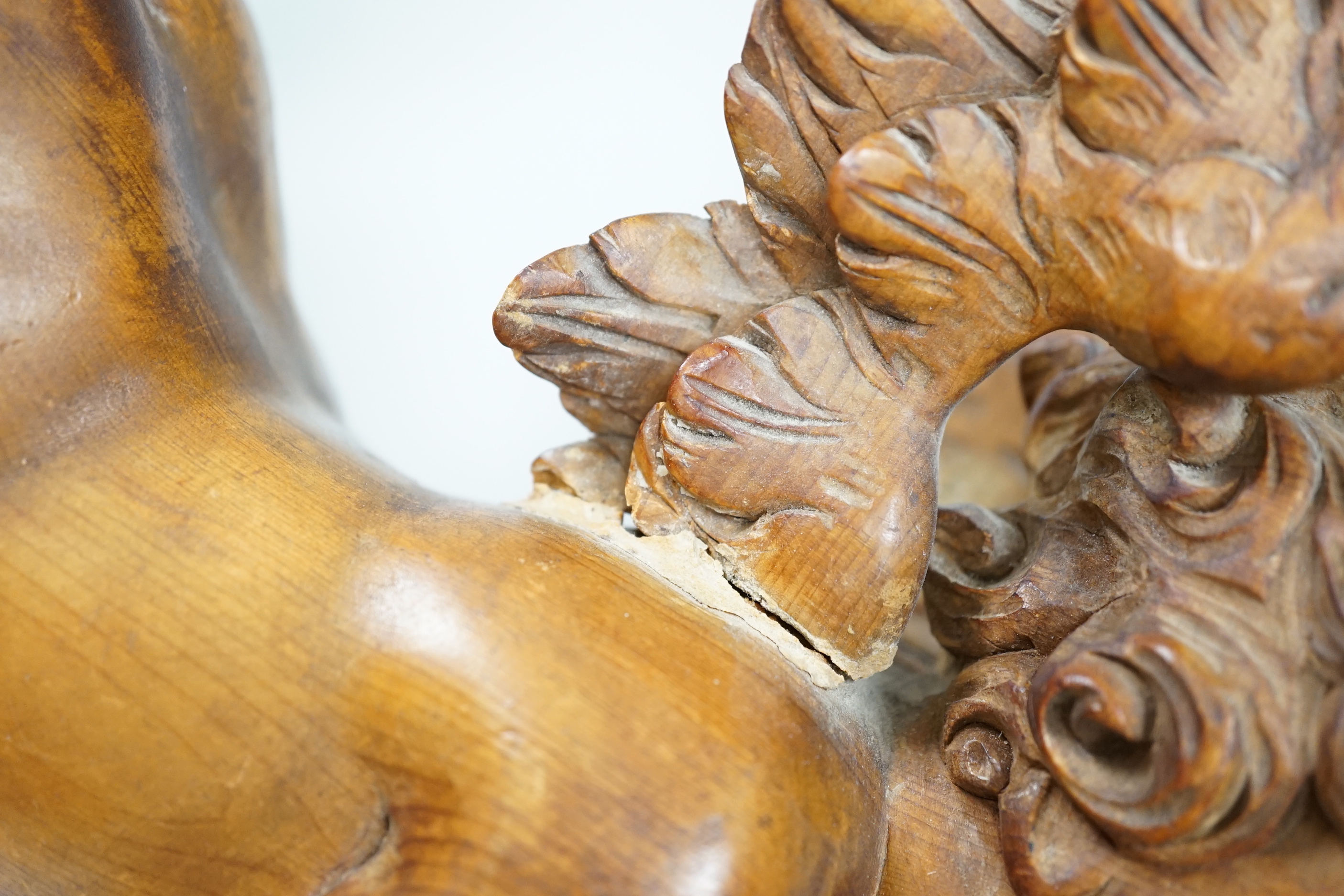 A carved pine cherub, 40cm (a.f.)